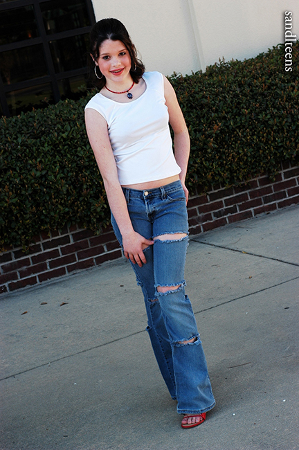 teen female model wearing jeans and top